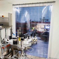Rideau à lanières PVC dans une fabrique d'huile