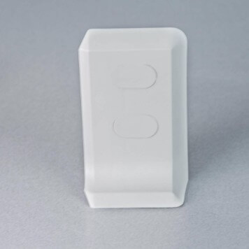 Embout droit gris-blanc pour plinthe PVC à lèvres souples avec bouchons insérés
